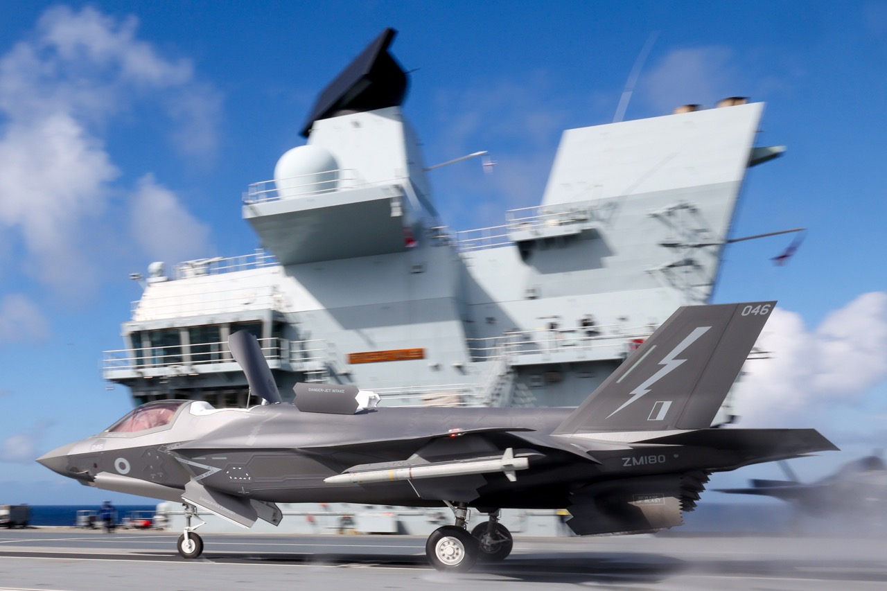 01 Jul 2026 – F-35B fifth generation fighter aircraft taking off from the flight deck of Fleet Flagship, HMS Prince of Wales.UK Carrier Strike Group is under the command of NATO as it conducts Air Policing in the vicinity of Iceland, the first time the mission has been conducted from an Aircraft Carrier. The Airborne Surveillance and Interception Capabilities to Meet ISL's Peacetime Preparedness Needs (ASIC-IPPN) is a peacetime mission, which is specific and unique to Iceland. UK CSG in conjunction with the Iceland authorities, is providing a presence of F-35B fifth generation fighter aircraft from 809 NAS embarked on HMS Prince of Wales, to keep Icelandic airspace safe and secure.This mission alongside previous exercises conducted with NATO Allies demonstrate the Strike Group's ability to operate effectively in a complex and strategically significant region while focused on NATO’s drive of preserving peace, security and cooperation in the Arctic. The multi-domain exercises reinforce collective defen